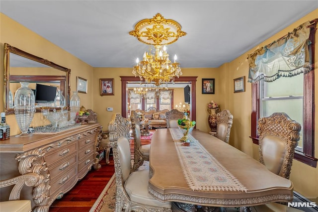 dining space with a baseboard radiator, dark hardwood / wood-style floors, and a chandelier