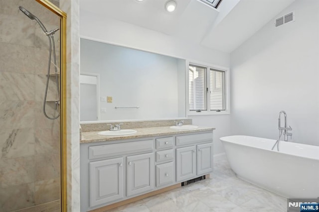 bathroom featuring lofted ceiling, vanity, and separate shower and tub