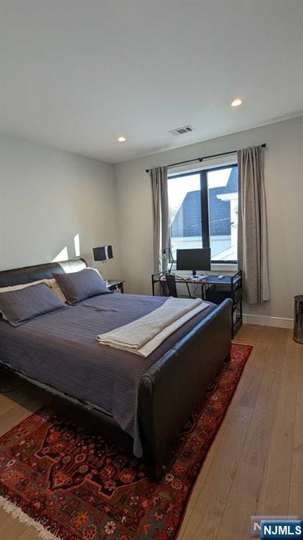 bedroom featuring light hardwood / wood-style flooring