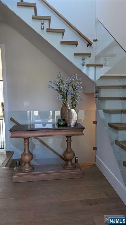 stairway featuring wood-type flooring