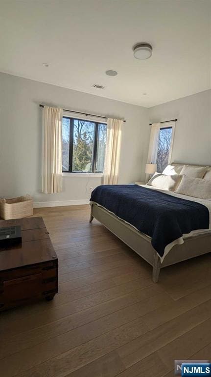 bedroom with hardwood / wood-style floors