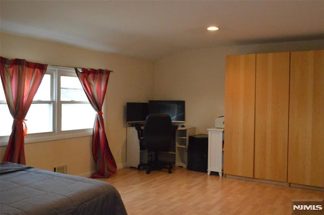 bedroom featuring light wood-type flooring