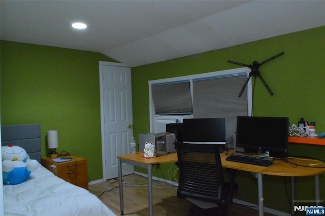 bedroom with lofted ceiling