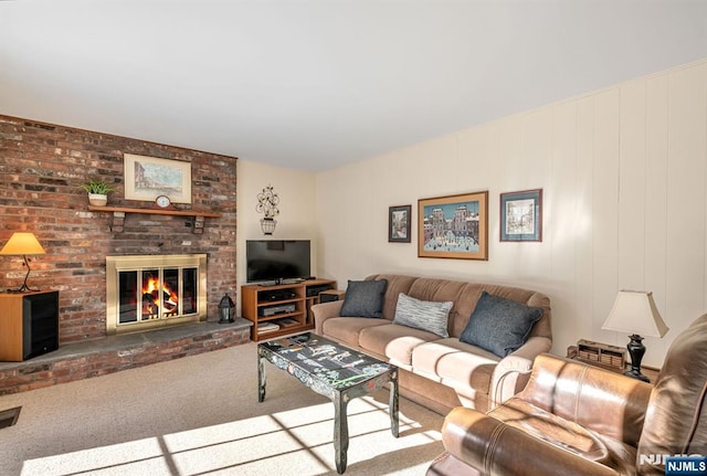 living room with carpet floors and a fireplace