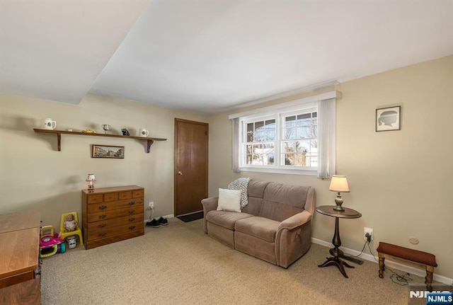 sitting room featuring carpet floors