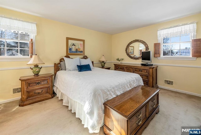 bedroom with light colored carpet