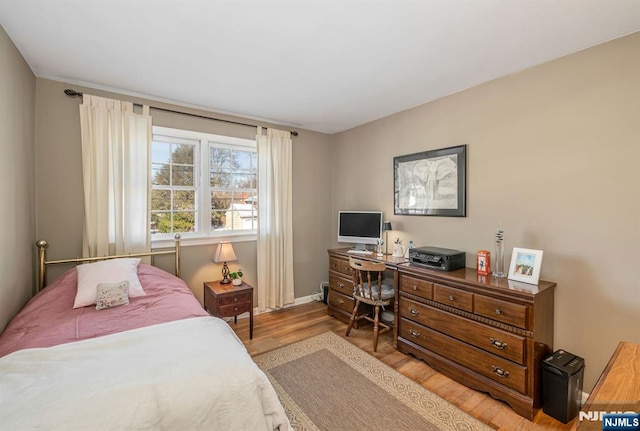 bedroom with light hardwood / wood-style flooring