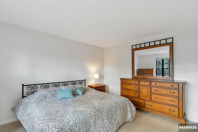 bedroom with light colored carpet