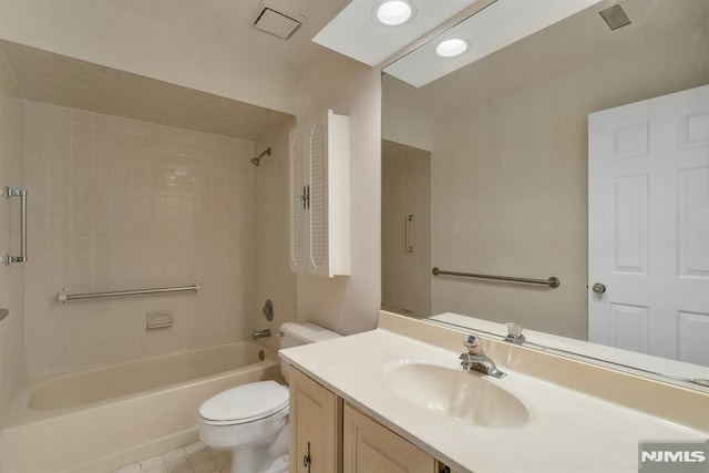 full bathroom with vanity, toilet, and tiled shower / bath combo