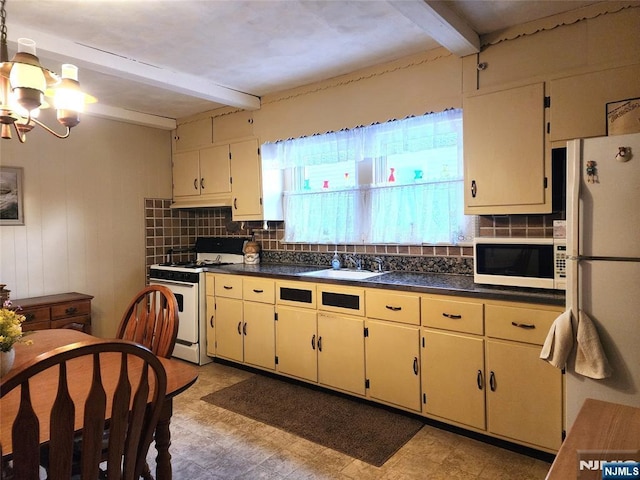 kitchen featuring sink, white appliances, cream cabinets, and beam ceiling