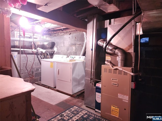 basement with washing machine and clothes dryer