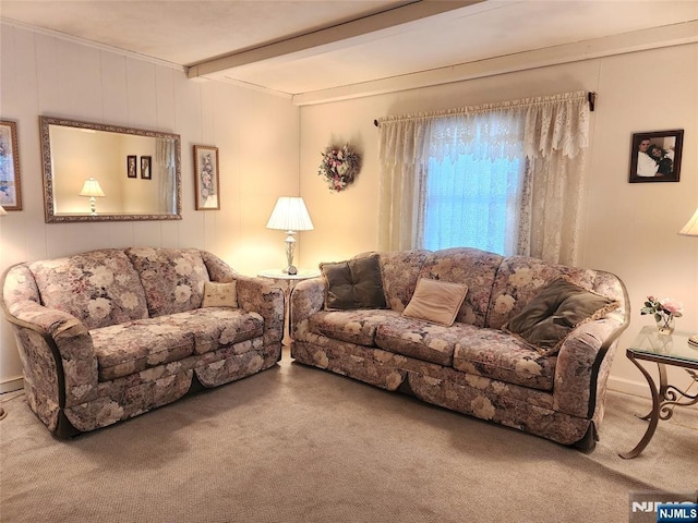 living room featuring beam ceiling and carpet