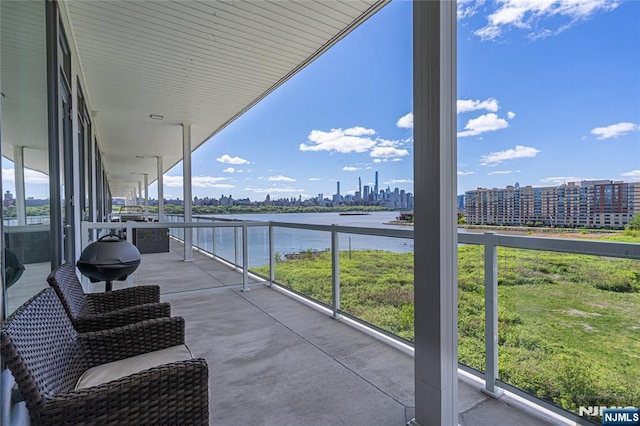 balcony featuring a water view