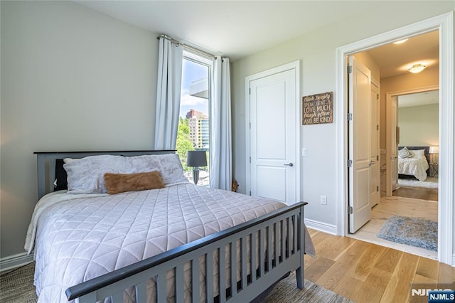 bedroom with wood-type flooring