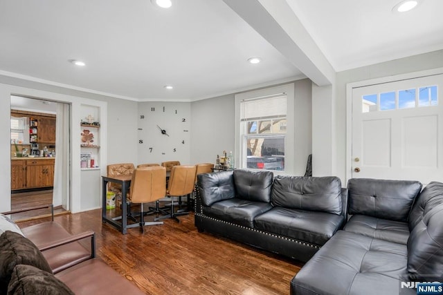 living room featuring ornamental molding and hardwood / wood-style floors