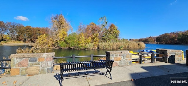 view of patio / terrace with a water view