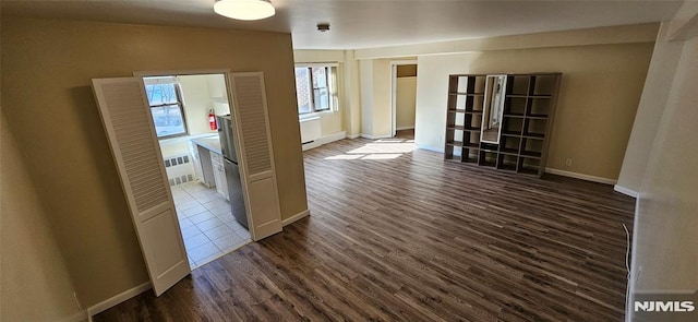 unfurnished room featuring dark hardwood / wood-style floors