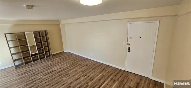 unfurnished room featuring hardwood / wood-style floors