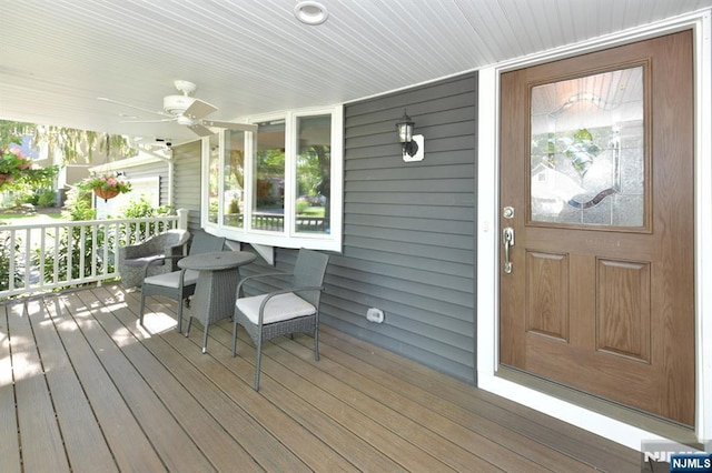 wooden deck with ceiling fan and covered porch