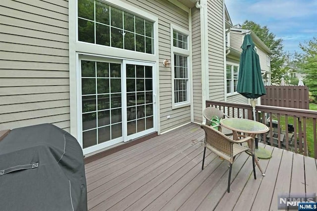 wooden deck with grilling area