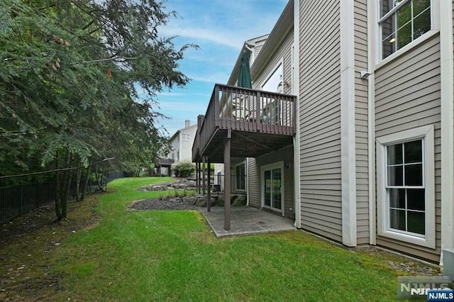 view of yard with a patio and a wooden deck