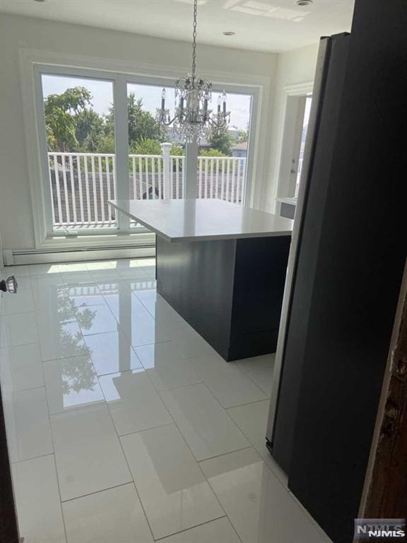 unfurnished dining area with light tile patterned floors