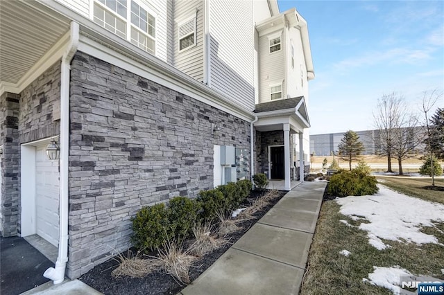 doorway to property featuring a garage