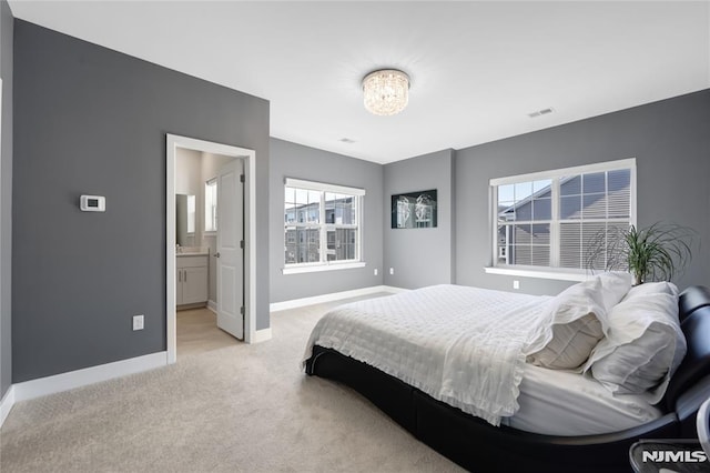 bedroom featuring light colored carpet