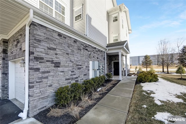 view of exterior entry featuring a garage