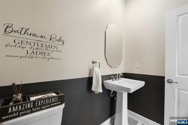 bathroom featuring sink and toilet