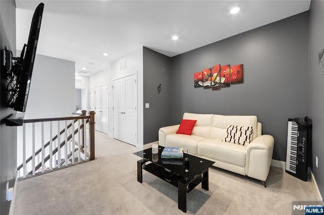 living room with light colored carpet