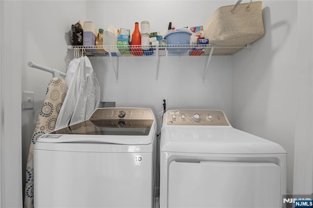 washroom with washer and clothes dryer