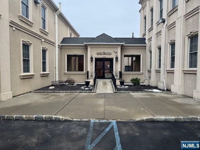 property entrance featuring french doors