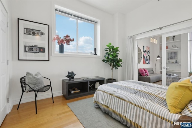 bedroom with light hardwood / wood-style flooring