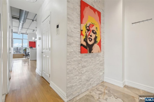 hallway featuring wood-type flooring