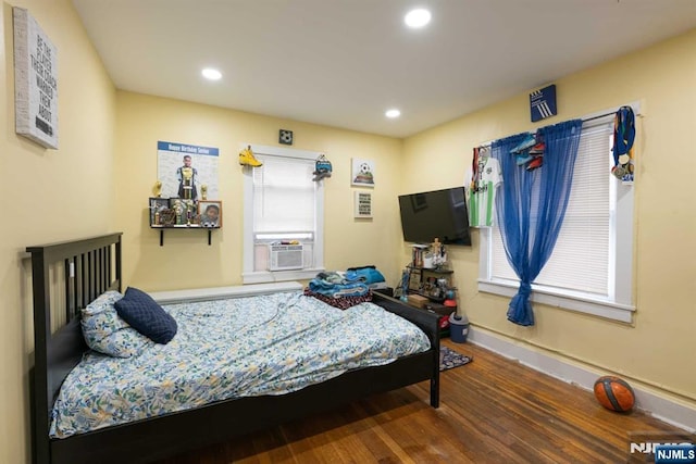 bedroom featuring cooling unit and wood-type flooring