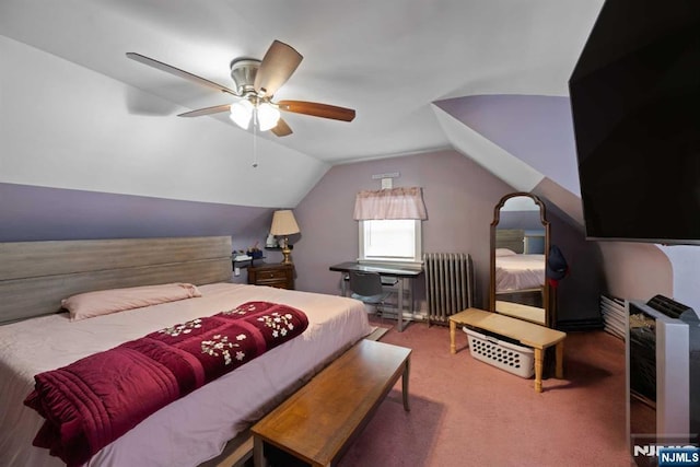 carpeted bedroom with ceiling fan, radiator, and vaulted ceiling