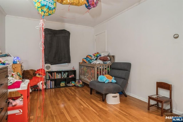 interior space featuring crown molding and hardwood / wood-style flooring