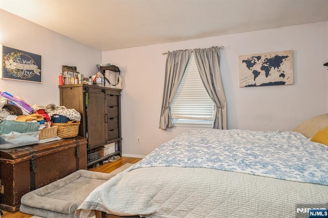 bedroom with wood-type flooring