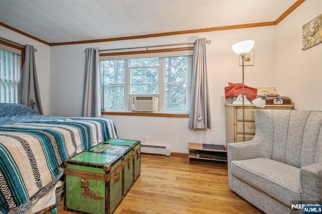 bedroom featuring cooling unit, crown molding, light wood-type flooring, and baseboard heating