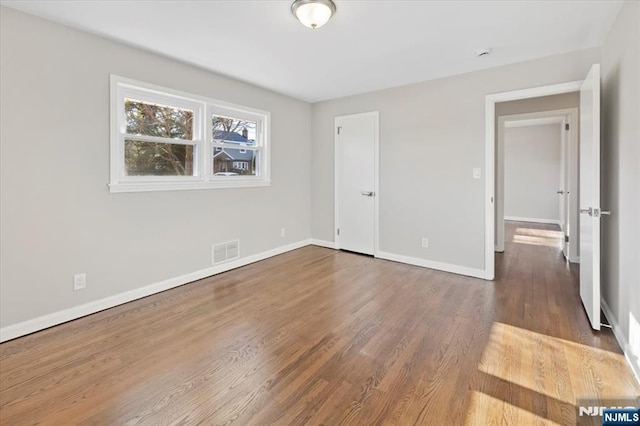 unfurnished bedroom featuring hardwood / wood-style floors