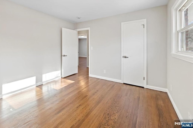 unfurnished bedroom featuring light wood-type flooring