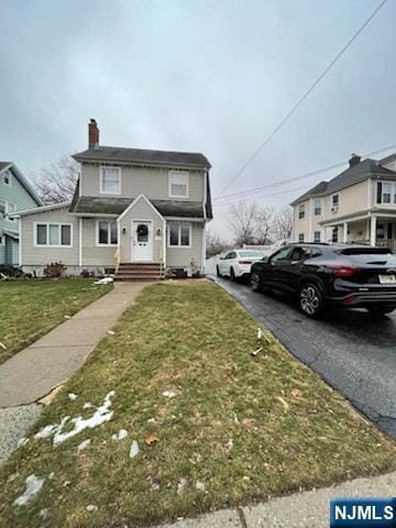 view of front property with a front lawn