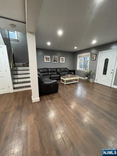 living room featuring dark hardwood / wood-style flooring