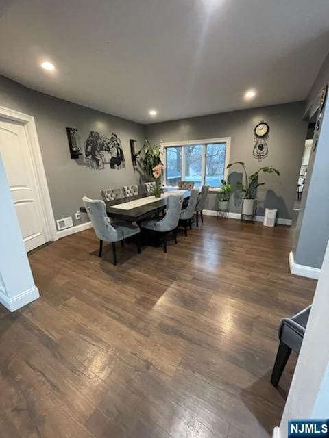 dining room featuring dark hardwood / wood-style flooring