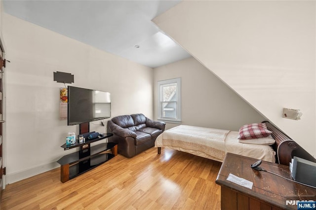 bedroom with light hardwood / wood-style floors