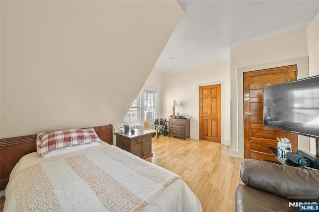 bedroom with light wood-type flooring