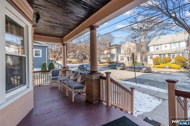 wooden deck featuring covered porch