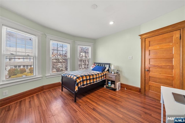 bedroom with wood-type flooring