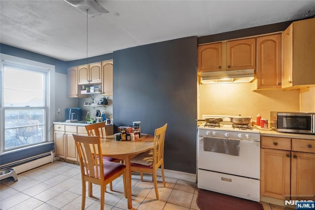 kitchen featuring sink, light tile patterned flooring, gas range gas stove, and light brown cabinets